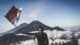 Top 50 Indonesian Phrases to Learn Before Your Trip 5 man wearing black crew neck sweater holding white and red flag standing near mountain under blue and white sky