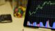 Mastering Options Trading: The Ultimate Guide To Understanding Relative Strength Index (RSI) (with Strategies)! 4 white android tablet turned on displaying a graph